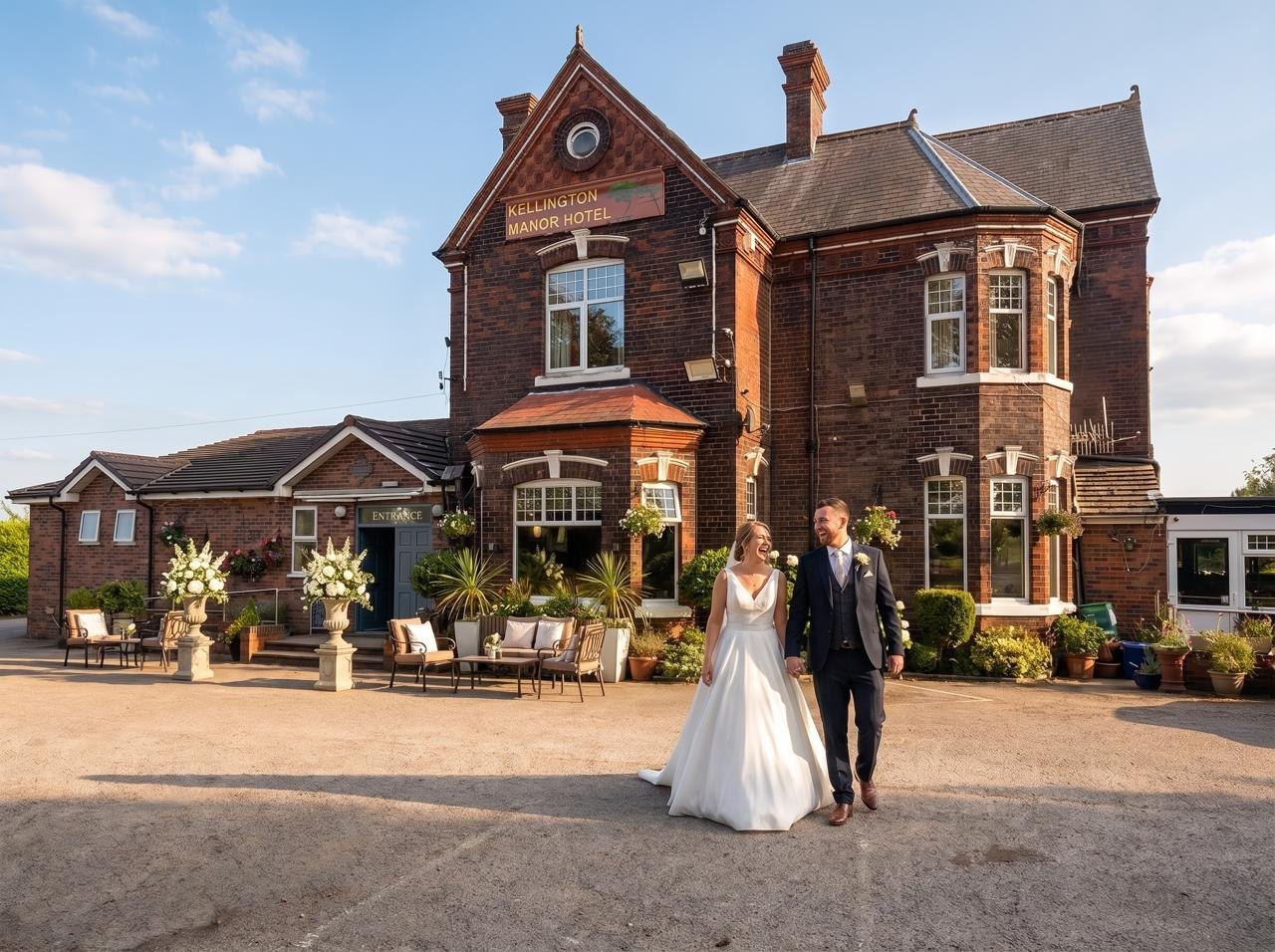 A couple walking up the drive at Kellington Manor