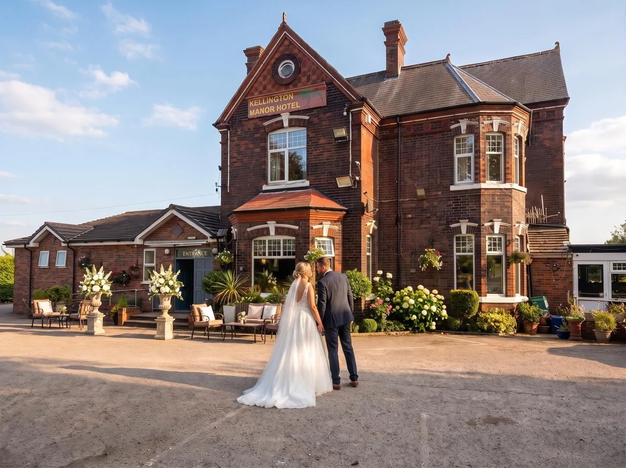 A couple outside the front of Kellington Manor