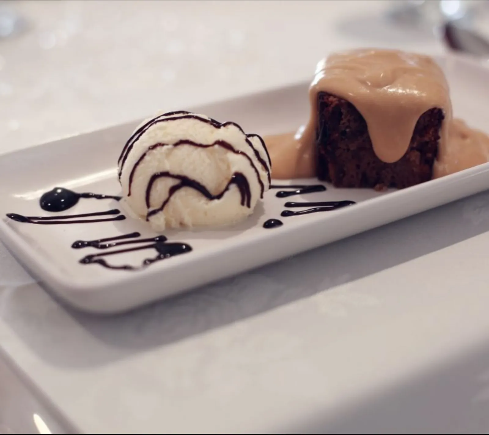 Sticky toffee pudding, plated in the Kellington Manor kitchen